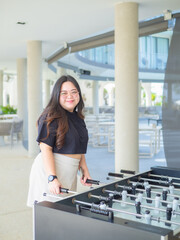 Body positive curvy Asian woman smiling and enjoying casual day.