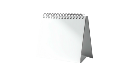 A blank white desktop calendar with a spiral bound top, set against black