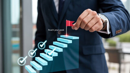 Businessman placing a flag on top of stairs, representing goal achievement