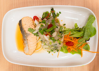 Spicy glass noodle salad with vegetables and salmon
