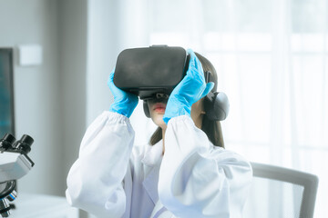 An Asian female scientist wearing a virtual reality headset explores digital simulations in a modern laboratory, surrounded by microscopes, test tubes,merging VR technology with advanced scientific