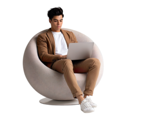Transparent Png of a Young Man Sitting in a Modern Round Chair, Casually Dressed and Focused on His Laptop, Depicting a Relaxed yet Productive Work Session