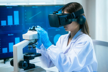 An Asian female scientist in a modern lab interacts with 3D holographic data using VR/MR headset, integrating microscopy, chemical analysis,computational biotechnology immersive, advanced scientific