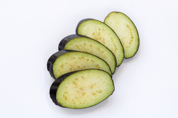 Eggplant slices on a seamless white background, perfect for product packaging, catalogs, or cooking blogs.