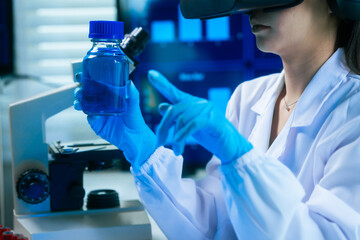An Asian female scientist in a modern lab interacts with 3D holographic data using VR/MR headset, integrating microscopy, chemical analysis,computational biotechnology immersive, advanced scientific