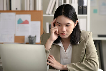 Young Asian Businesswoman looking stressed from work, Young businesswoman working at office feels overworked and burnout, Healthcare office syndrome concept