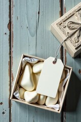 Elegant Gift Box with Creamy White Heart-Shaped Treats and Blank Tag