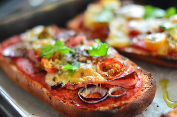 Close-up of a freshly baked zapiekanka baguette topped with vegetables, tomatoes, and fresh herbs, showcasing vibrant colors and appetizing textures, perfect for food, culinary, and gourmet projects