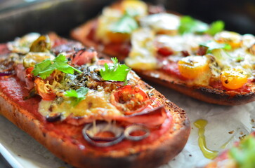 Close-up of a freshly baked zapiekanka baguette topped with vegetables, tomatoes, and fresh herbs, showcasing vibrant colors and appetizing textures, perfect for food, culinary, and gourmet projects