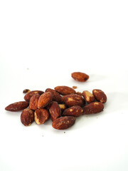 Close up Almonds bean on white background. Fruit bean for energy breakfast, brunch snack, and vegetarian. Healthy food contains antioxidants nutrients vitamins. Kernel Grains almond nutrition 