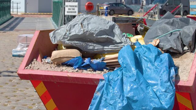 Wind Blows Blue Tarp in Construction Skip, Cromarty Street