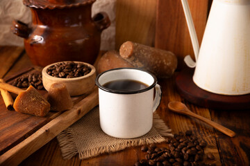 Café de olla, a traditional spiced Mexican black coffee, the recipe varies by region, with cinnamon, brown sugar, or piloncillo, and some recipes include cloves and star anise.