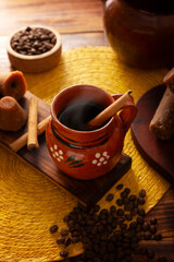 Café de olla, a traditional spiced Mexican black coffee, the recipe varies by region, with cinnamon, brown sugar, or piloncillo, and some recipes include cloves and star anise.