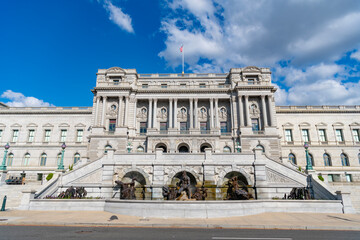 Congress in Washington DC. Congress building under blue sky. Washington DC landmark. American flag...