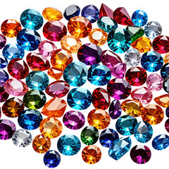 Colorful jewels, gems, and precious stones scattered on a black surface