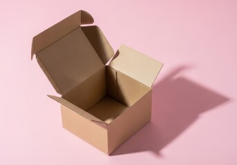 Open cardboard box on a pink background with dramatic shadow