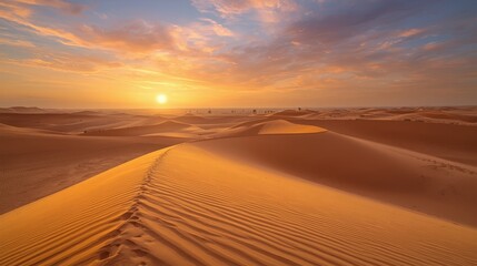 A scenic view of a desert landscape with sand dunes and a bright sun in the background during sunset