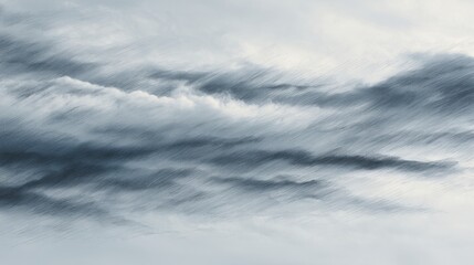 A serene sky filled with soft, flowing clouds in shades of gray and blue, creating a tranquil atmosphere.