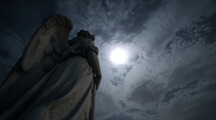A stone angel statue stands under a dramatic, cloudy sky illuminated by a bright moon, creating a mystical atmosphere.