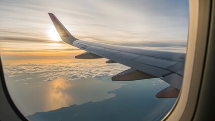 Fototapeta premium Airplane Wing Silhouetted Against Vibrant Sunset Sky From Window View