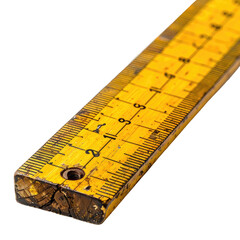 Close-up of an old, yellow wooden ruler with visible measurements and wear