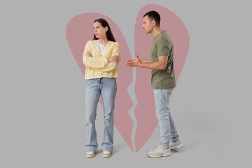 Fototapeta premium Young quarreling couple and broken heart on grey background. Concept of relationship problems