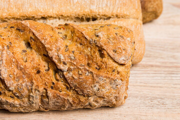 Homemade natural breads. Different kinds of fresh bread as background, perspective view with copy space