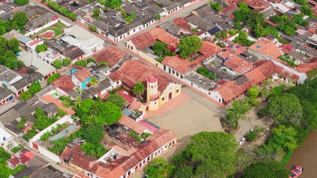Drone shot flying over the historic colonial town of mompox, a unesco world heritage site in colombia