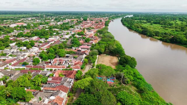 Aerial rising shot of the historical town of mompox on the banks of the magdalena river in colombia