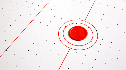 Subject shot of air hockey game table close-up. The portable table hockey includes plastic hockey paddles, a mini puck and score keepers. Hobby game background. Backdrop with copy space. High quality.