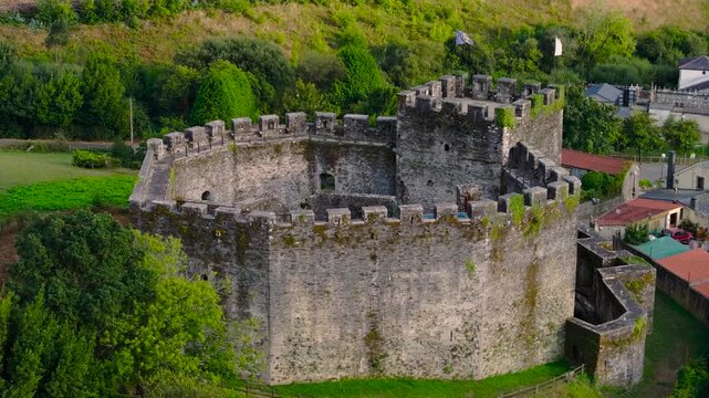 Ancient Stone Castle Of Moeche In San Xurxo de Moeche, A Coru&ntilde;a, Spain. Aerial Pullback Shot