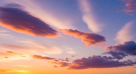 Obraz premium Picturesque clouds illuminated by the sunset, creating a serene vista