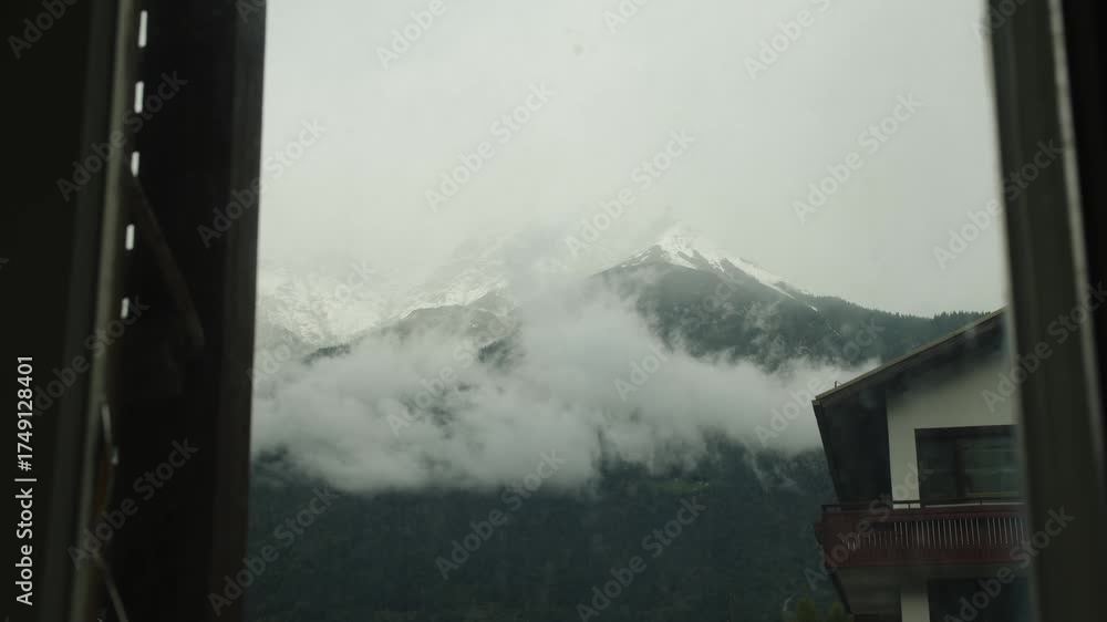 Wall mural slow-moving time-lapse of soft clouds seen through a window. ideal for meditation, stillness, or int