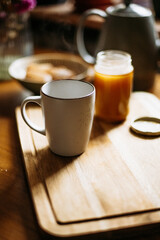 Steaming cup with honey jar