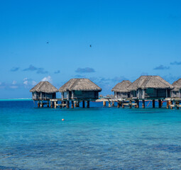 Post Covid abandoned bungalows along the coast of Bora Bora, French Polynesia, South Pacific Ocean