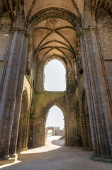 Fototapeta premium The abbey of Saint-Mathieu de Fine-Terre in Brittany, France. Ancient gothic ruin interior with arched vaults, stone columns, and open courtyard view
