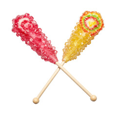 Two vibrant rock candy sticks, one pink/red/white swirl, one multi-colored swirl, glossy, crystallized, on white sticks, isolated on a transparent background with copy space, concept of cheerful
