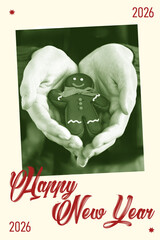 Hands hold a gingerbread cookie while celebrating New Year in 2026