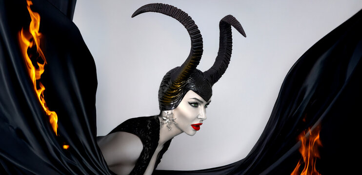 Dark queen with black horns and red lips in dramatic Halloween portrait Witch with smoke &mdash; fantasy and villain inspired look