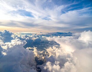 Naklejka premium A breathtaking aerial view of fluffy white clouds against a blue sky with sunlight