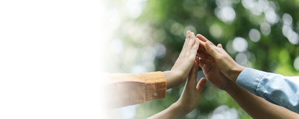 Environmental concept, business people join forces on World Environment Day and global community teamwork the global environment, society and environment CSR and sustainable development. Copy space