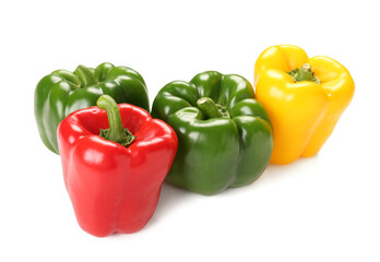 Many fresh colorful bell peppers on white background