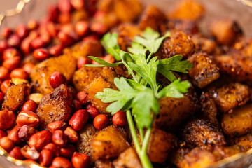 Kelewele, Fried Ripe Plantain Seasoned with Ginger, Cloves, and Pepper, Served with Roasted Groundnuts, a Popular Spicy Ghanaian Snack