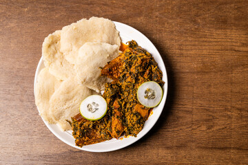 Yake Yake, Grated Cassava With Amatadzi, Spicy Green Leaf Stew, Agushi and Tuna cooked into a couscous-like texture, Africa Ghana Traditional Dish