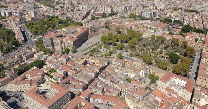 Aerial view of the Palazzo dei Normanni, also known as Royal Palace, in the historic center of Palermo, Sicily, Italy. It's located near Villa Bonanno, a public city park with trees in Vittoria square
