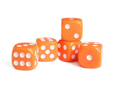 Many orange game dices on white background