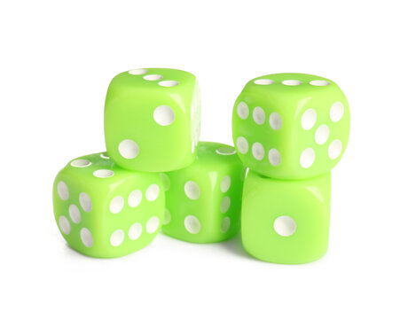 Many green game dices on white background