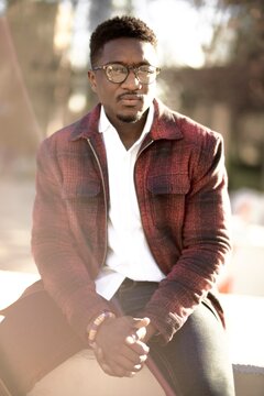 sceptical African man with glasses