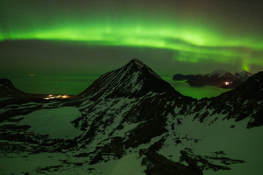 Northern Lights over Myrland and mountains, Lofoten Islands, Norway
