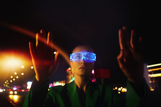 Woman in Futuristic High-tech VR Eyewear in night city. Artifici